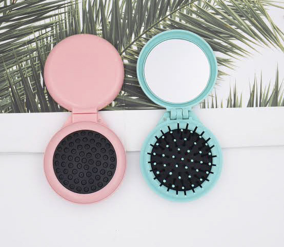 A mirror that can also function as a brush
